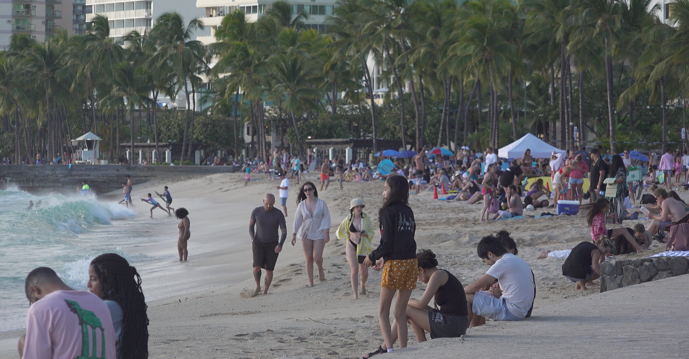 tourists on waikiki beach oahu hawaii
