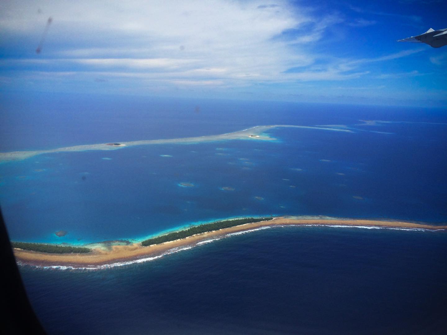 Airplane arrival plane window view of funafuti tuvalu