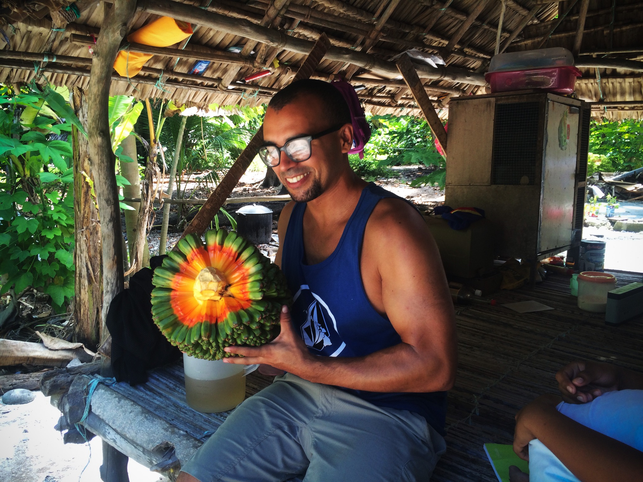 Holding a pandanus fruit in Kiribati outer islands