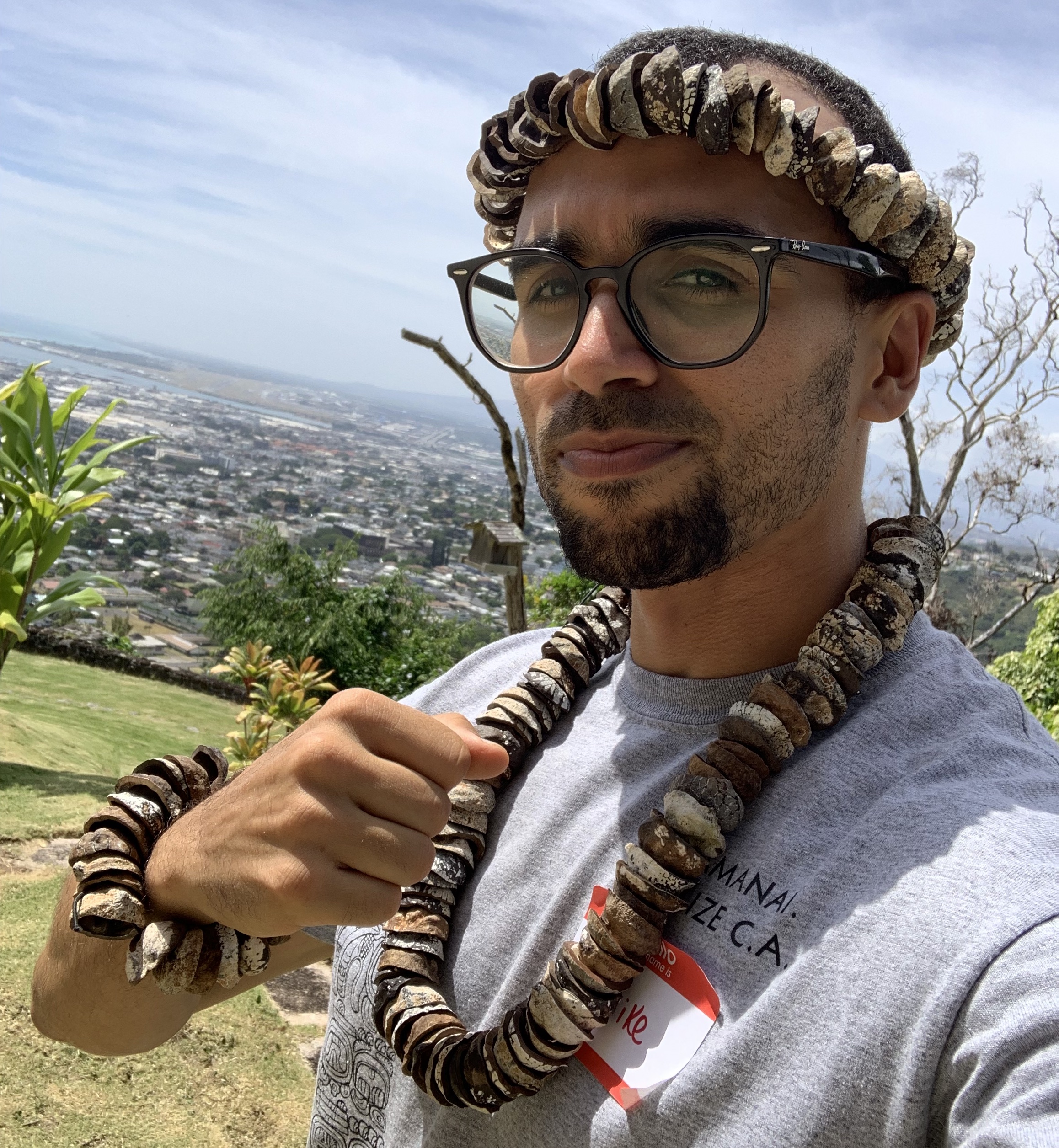 wearing a hawaiian kukui lei